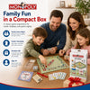 A family playing Monopoly board game with a box and various game components on a wooden table.