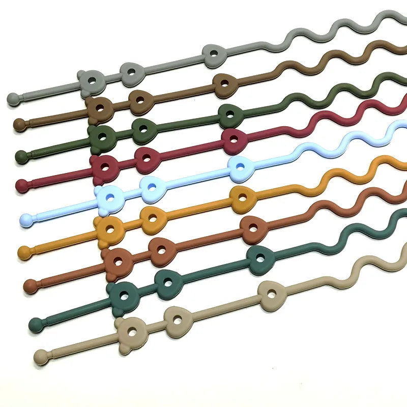 A set of silicone pacifier clips with anti-drop chains in various colors and shapes.