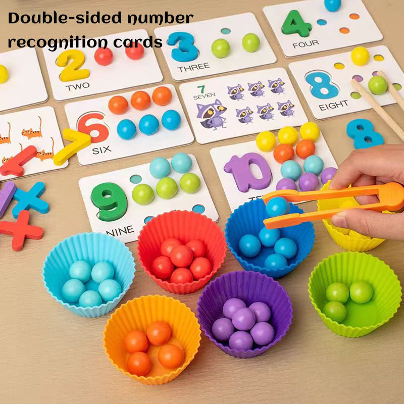 A collection of double-sided number recognition cards and colored wooden clip beads for Montessori learning.