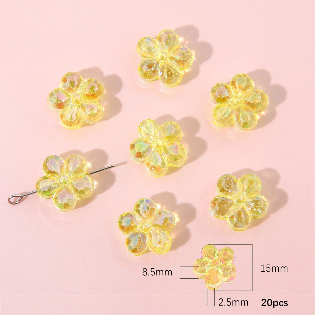 A collection of yellow translucent acrylic flower beads for DIY jewelry making, showing various sizes and a measurement scale