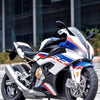 A white and blue S1000 RR die-cast model motorcycle with front steering displayed on a dark surface.