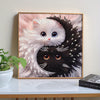 Diamond painting of a white and black cat face in yin yang style