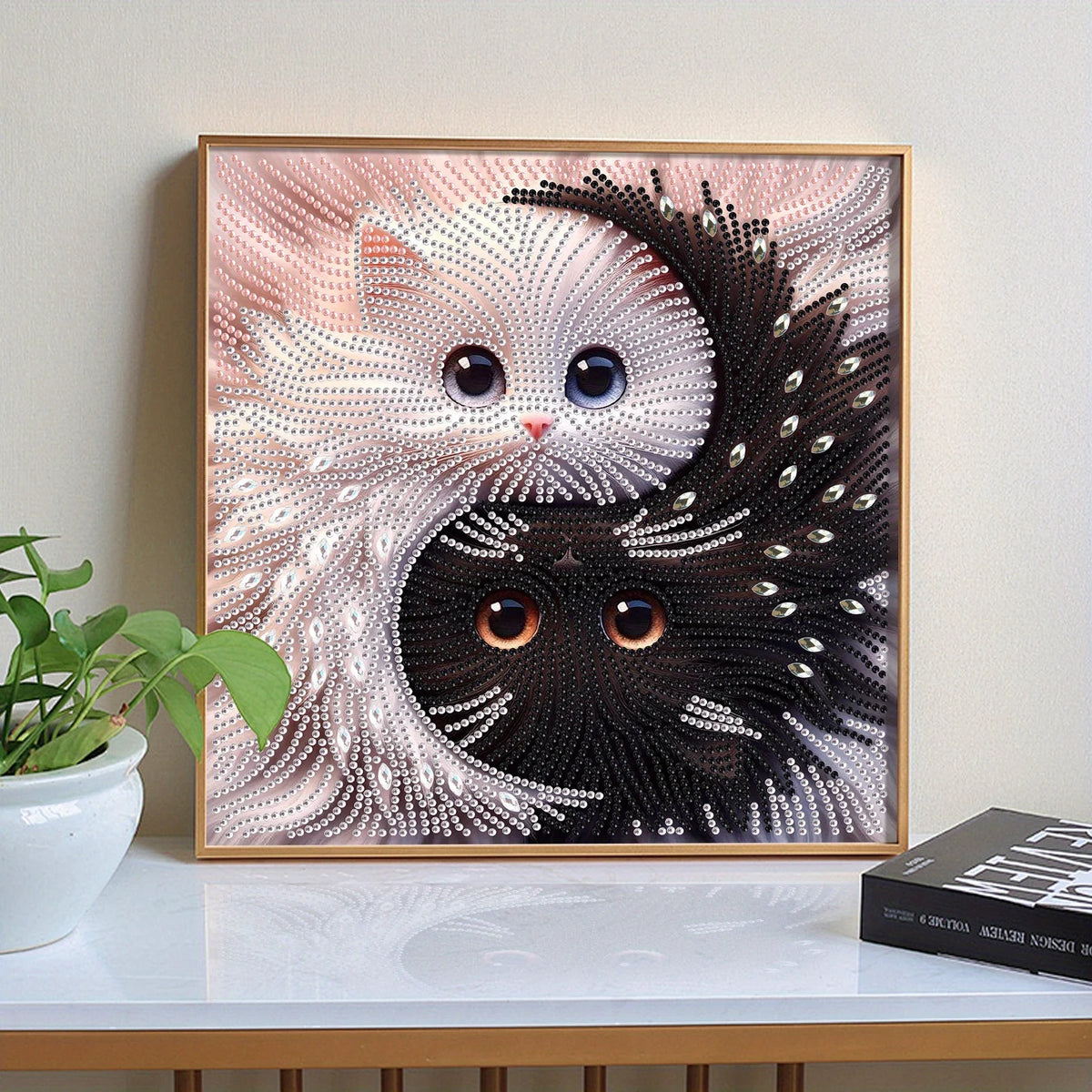 Diamond painting of a white and black cat face in yin yang style