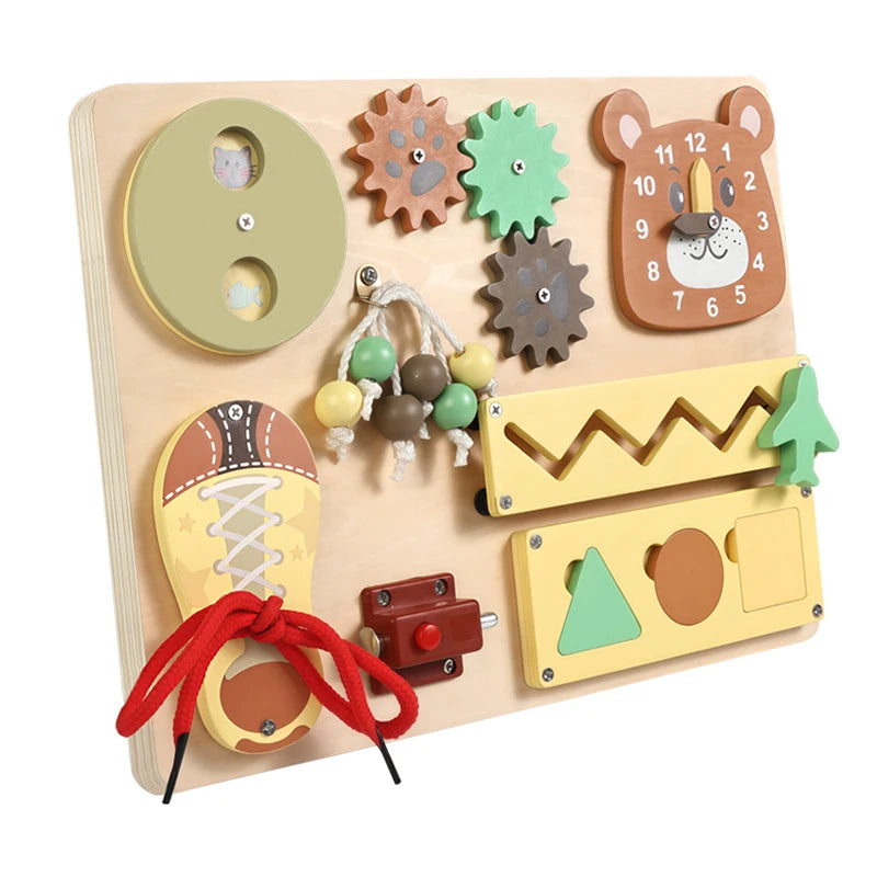 A wooden busy board for Montessori activities featuring various textured and musical components like a bear face, gears, and 