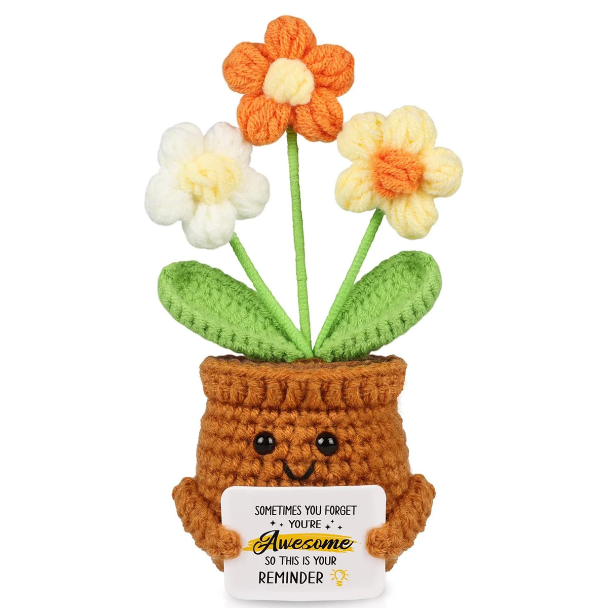 Handmade crochet sunflower pot doll with orange and yellow flowers growing out of a brown pot