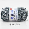 A ball of gray yarn labeled as Jim Jane cotton yarn for knitting and crochet