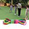 Rainbow elastic jump rope training band with multiple colored ropes laid out on a surface.
