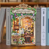 A miniature wooden book nook kit depicting Monet's studio with detailed paint and decorative elements.
