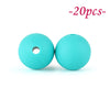 Two bright turquoise silicone beads, one hollow and one solid, are shown against a white background.