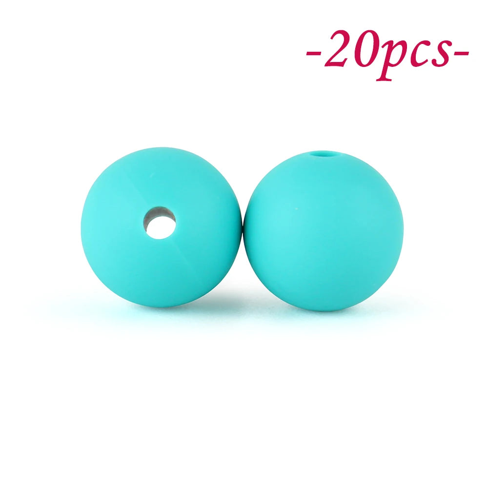 Two bright turquoise silicone beads, one hollow and one solid, are shown against a white background.