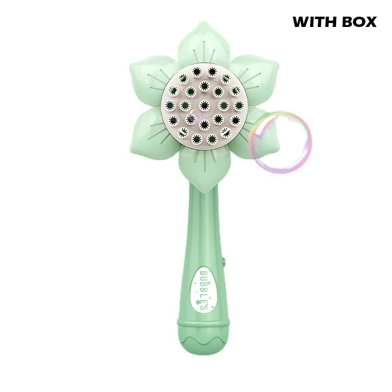 A light green sunflower-shaped electric bubble blower toy with a perforated head and a clear ring.