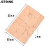 A rectangular cork replacement for saxophone necks, measuring 60mm by 40mm and 2mm thick.