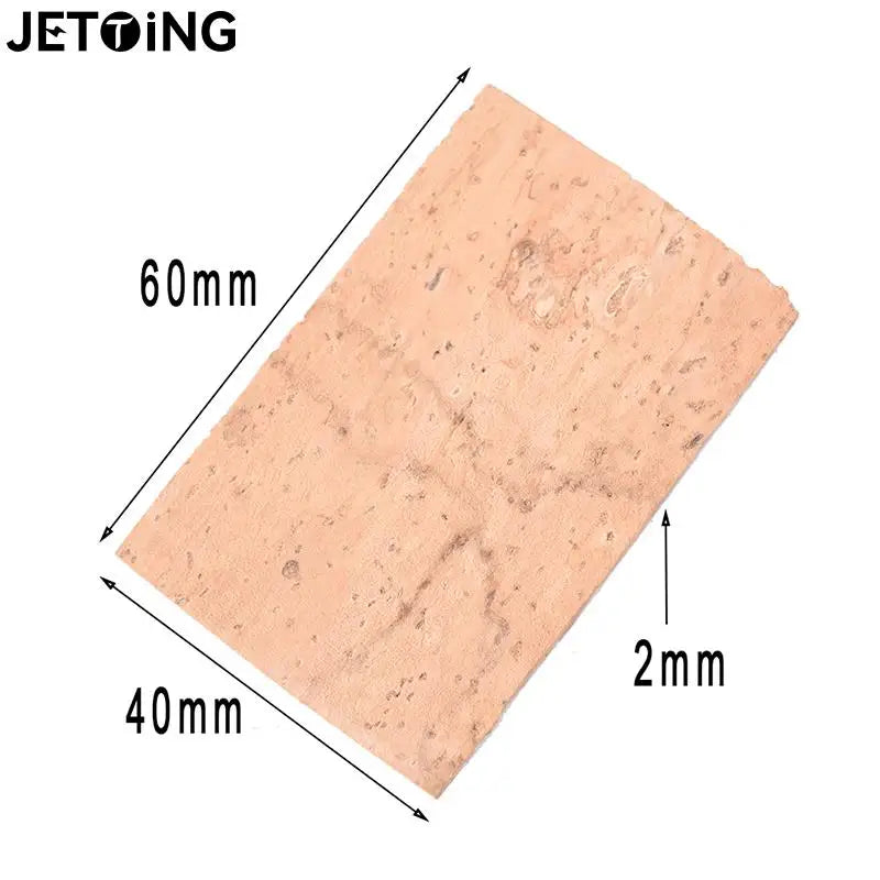 A rectangular cork replacement for saxophone necks, measuring 60mm by 40mm and 2mm thick.
