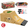 A set of skateboard park elements including ramps, rails, and a skateboard, packaged in a cardboard box.