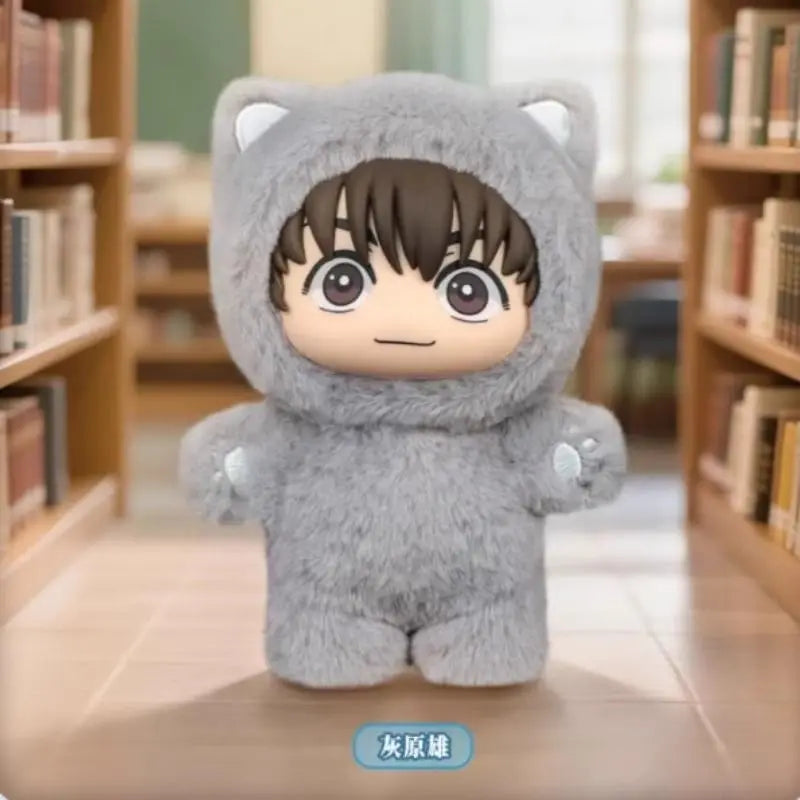 A plush collectible figure of Gojo Satoru in a cat costume with dark hair sitting on a wooden floor.