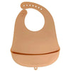 A light peach silicone baby bib with a catch pocket for feeding