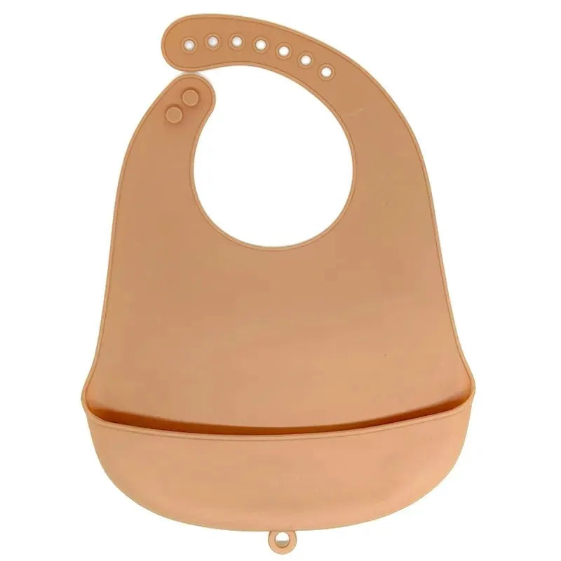 A light peach silicone baby bib with a catch pocket for feeding