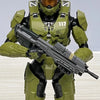 A 1/12 scale Master Chief action figure in olive green armor and helmet holding an assault rifle.