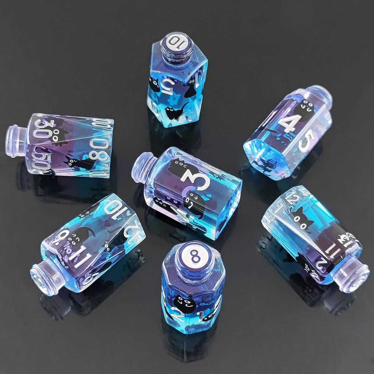 A collection of seven floral resin potion bottle polyhedral dice set in various shades of blue and purple.