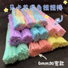 A collection of colorful pipe cleaners in various shades and textures, packaged for DIY crafting projects.