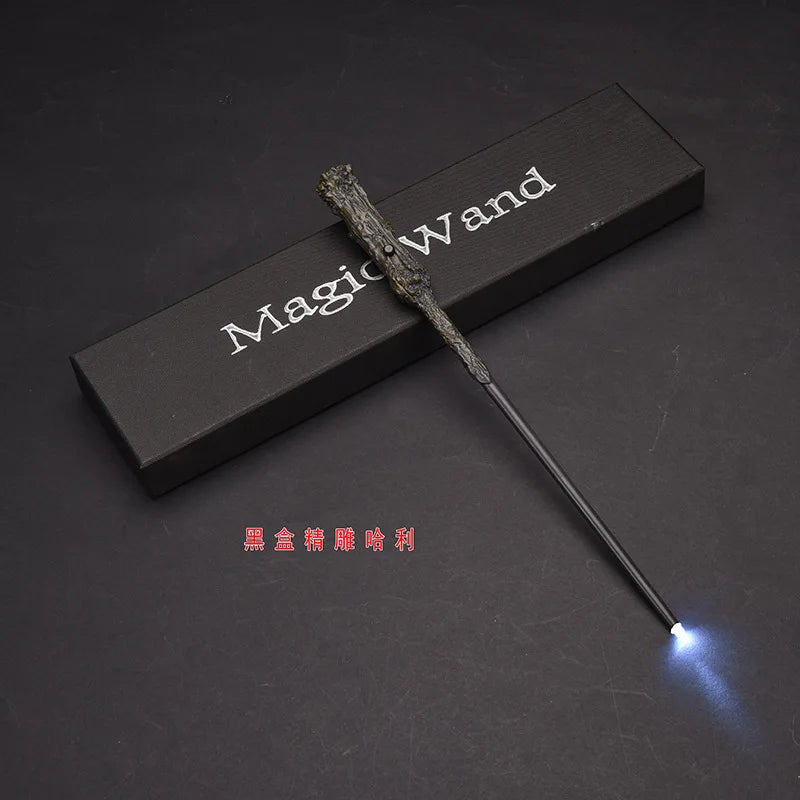 A dark wooden magic wand with a glowing LED tip is displayed on a dark surface.