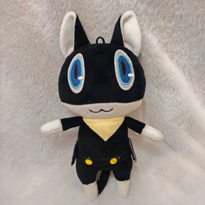 A black and white plush doll resembling the character Morgana from Persona 5