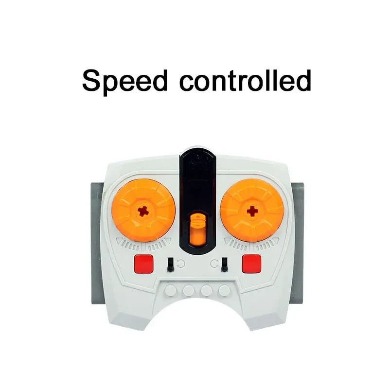 A white electronic device labeled Speed controlled with orange buttons and a black switch.