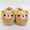 Pair of brown Rilakkuma plush indoor slippers with yellow accents