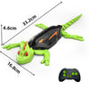 A green lizard robot toy with black armor and orange accents is shown next to its remote control.