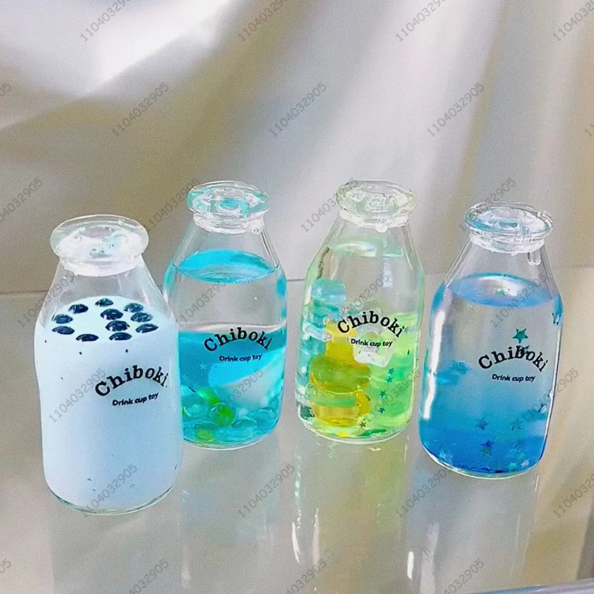 A set of clear glass bottles filled with colorful liquids, labeled Chiboki drink cup toy.