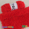 A bright red chunky faux fur yarn is displayed with a spool of black and white yarn visible on top.