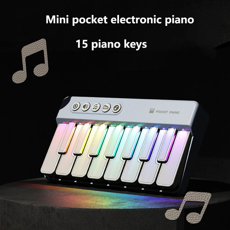 A mini pocket electronic piano with 15 colorful LED keys displayed on a dark surface.
