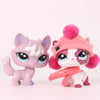 A pink shorthair cat bobble head figurine with a pink knitted hat and accessories.