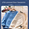 A blue film-pressed bear sweatshirt and a cream-colored bear sweatshirt are displayed on a light background.
