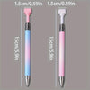 A pair of gradient rotating dotting pens shown side by side in pink and blue colors.
