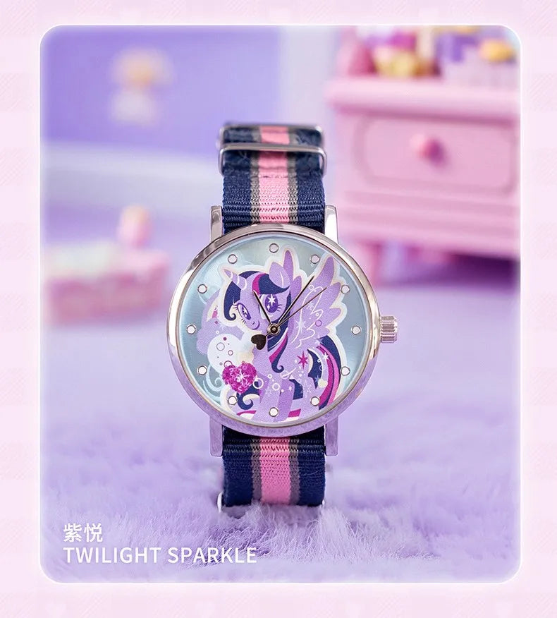 A Twilight Sparkle themed watch with a purple and pink strap displayed on a soft purple surface.
