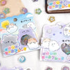 A collection of heart-shaped crystal stickers featuring cats and purple accents on white paper.