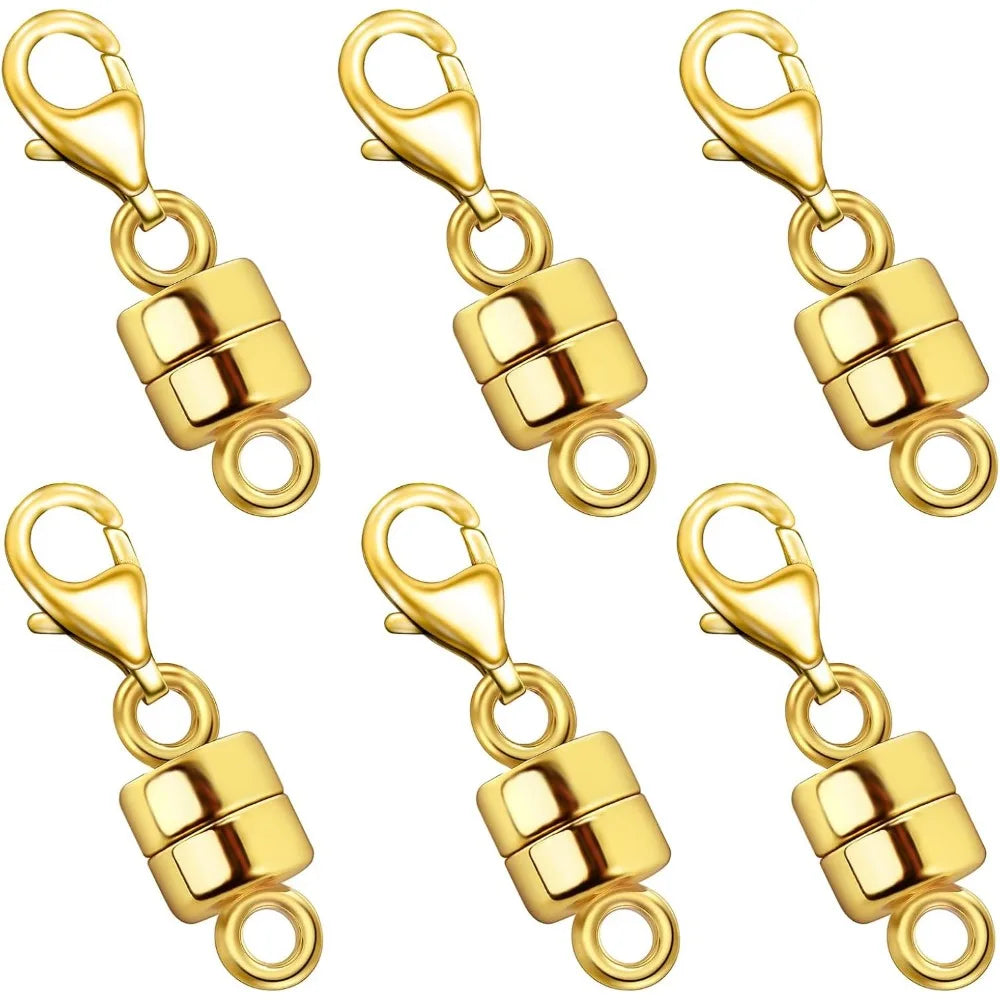 A set of gold-colored magnetic jewelry clasps for necklaces and bracelets.