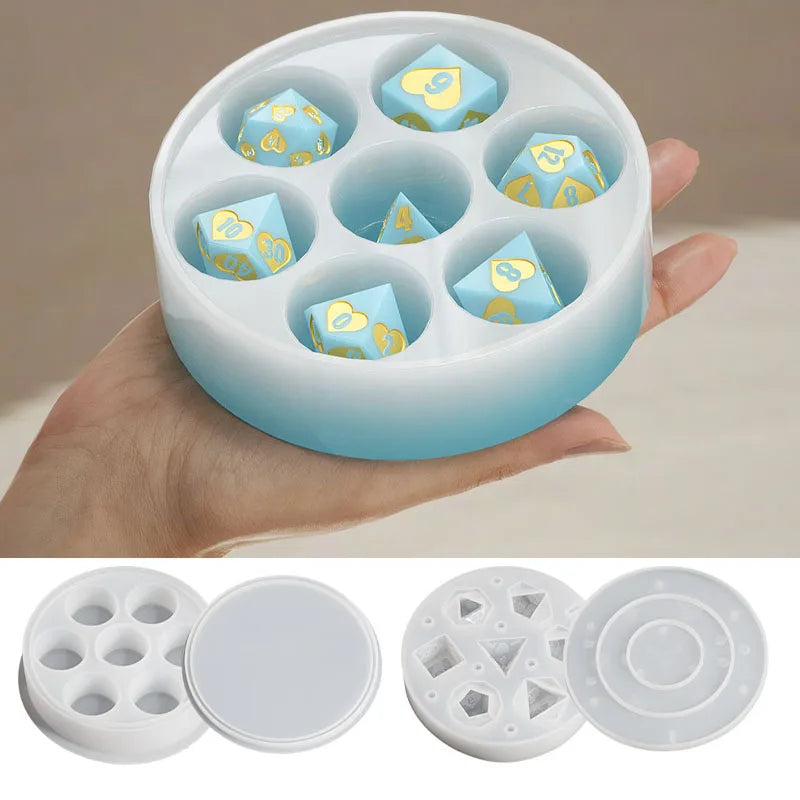 A hand holds a white silicone resin mold set with multiple hexagonal compartments for custom dice boxes.