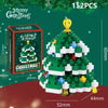 A green Christmas tree built from M1129 spell building blocks with a gold topper and festive packaging.