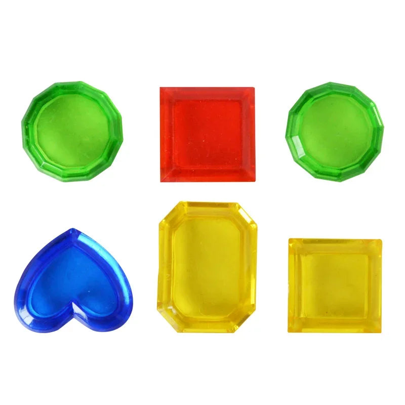 A collection of five colored plastic pool diving toys including green, red, blue, and yellow shapes.