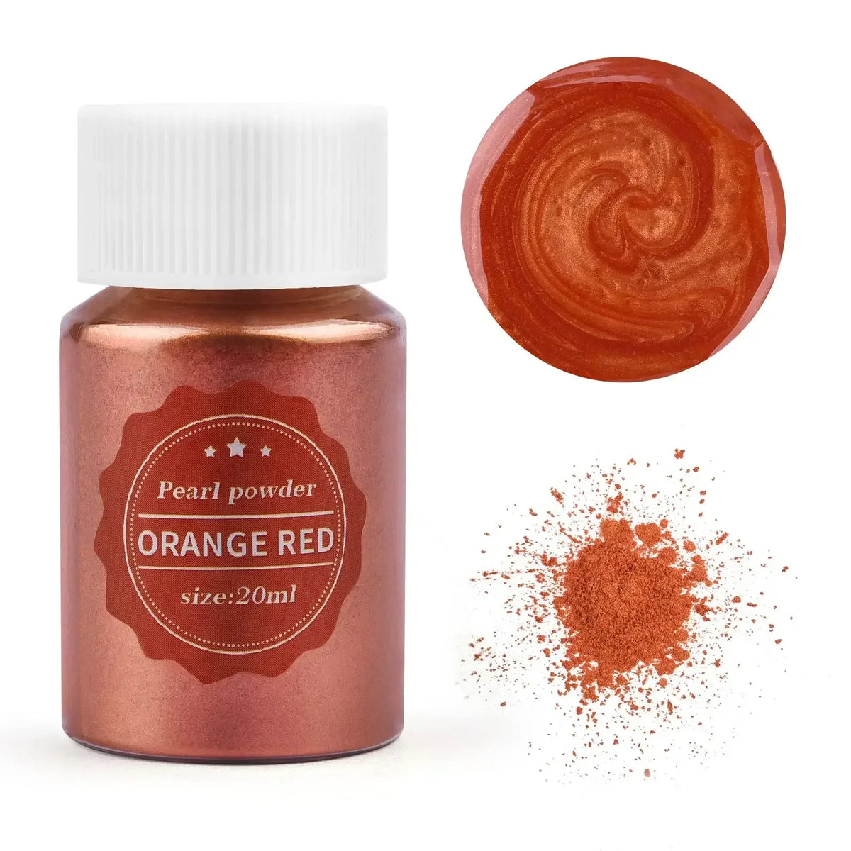 A glass jar of orange red pearl powder next to a swirl of the same color and scattered powder.