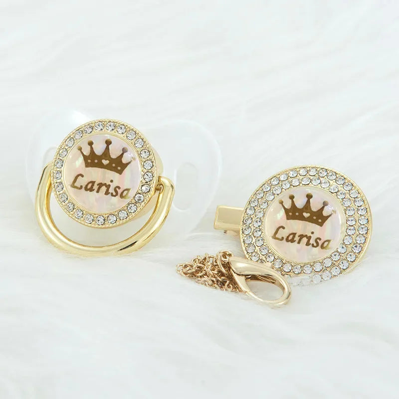 Personalized rose gold crown pacifier and clip set with a pearl and diamond design
