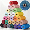 A collection of spools of 3mm cotton macrame cord in various shades of pink, green, yellow, and blue.