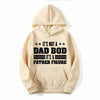 A light beige hoodie featuring a graphic print that reads It's not a dad bod it's a father figure