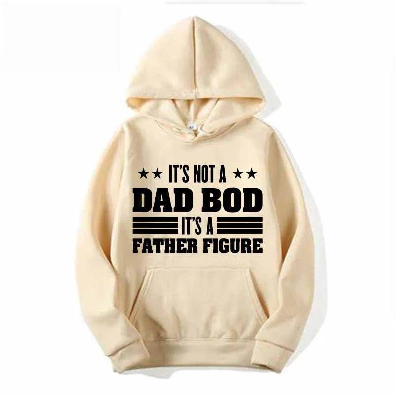 A light beige hoodie featuring a graphic print that reads It's not a dad bod it's a father figure