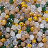 Mixed color faceted rondelle glass beads in shades of yellow, green, and beige for jewelry making