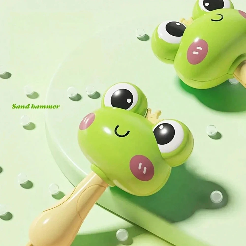 A lime green sand hammer toy with a light wood handle and large eyes is shown on a light green surface.