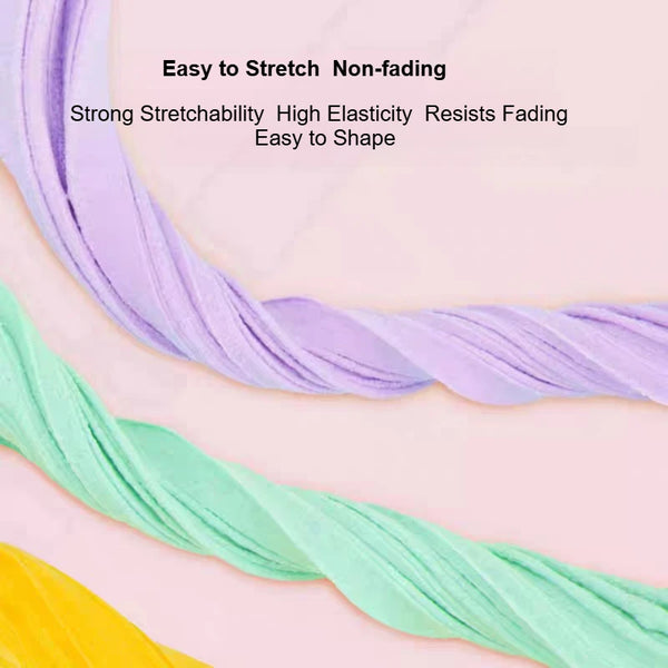 Colorful air dry modeling clay strands in purple and green showing stretchability