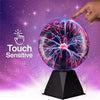 A hand touches a glowing purple plasma ball lamp that displays bright blue electrical discharge against a purple background.